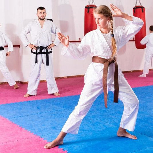 Young women training for Martial Arts on foam mats