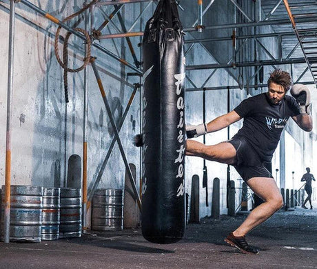 Young Male Kickboxing in MMA Gym