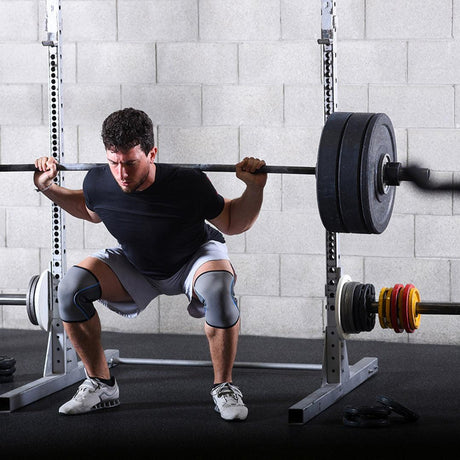 Man powerlifting in an industrial gym space